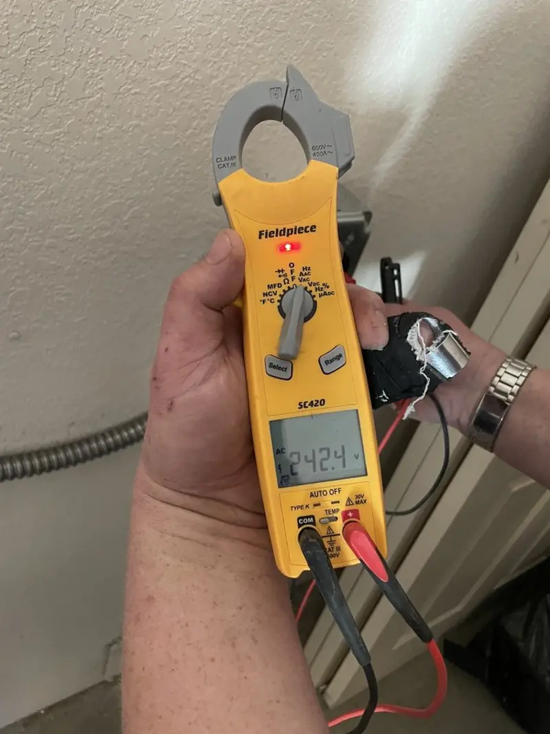 Voltage testing with clamp meter during Electrical Installation Services in Hurricane